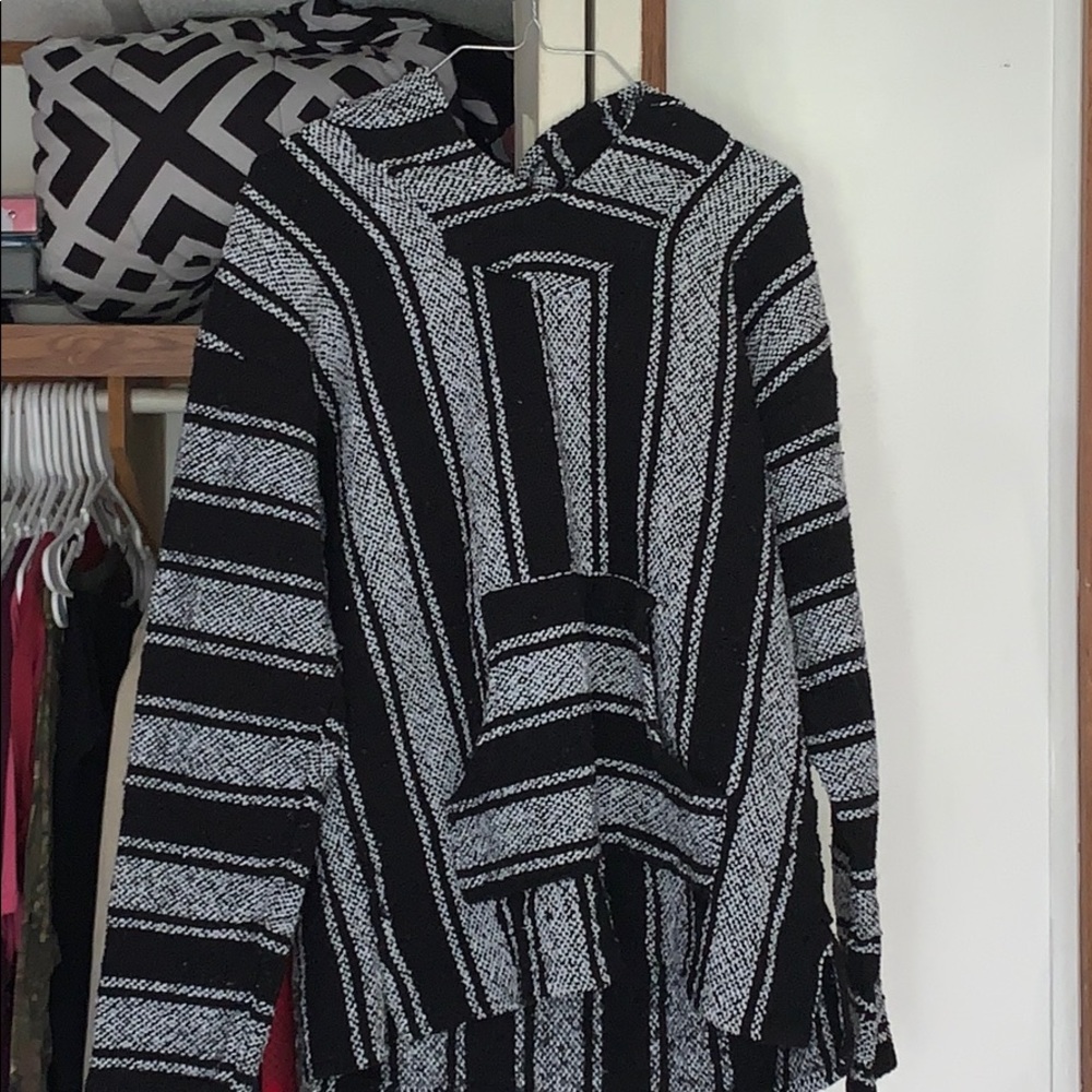 A brand new black and white drug rug has a pocket